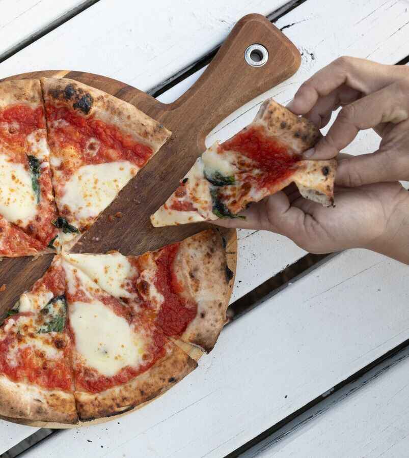Hand-pulled margherita slice