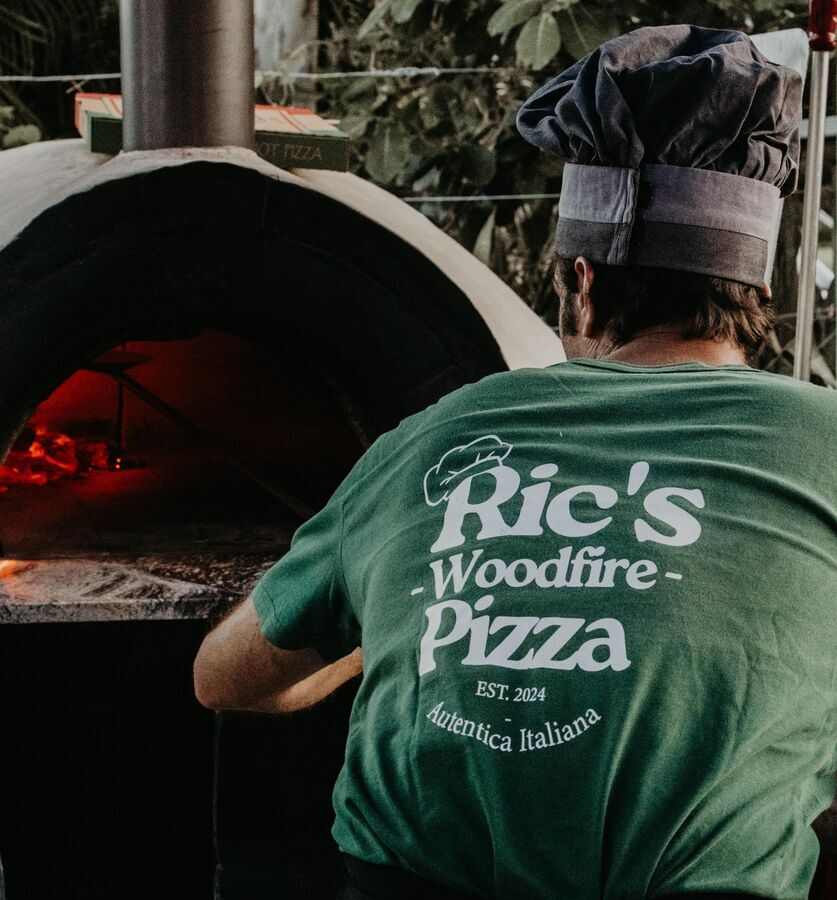 Ric working the woodfire oven