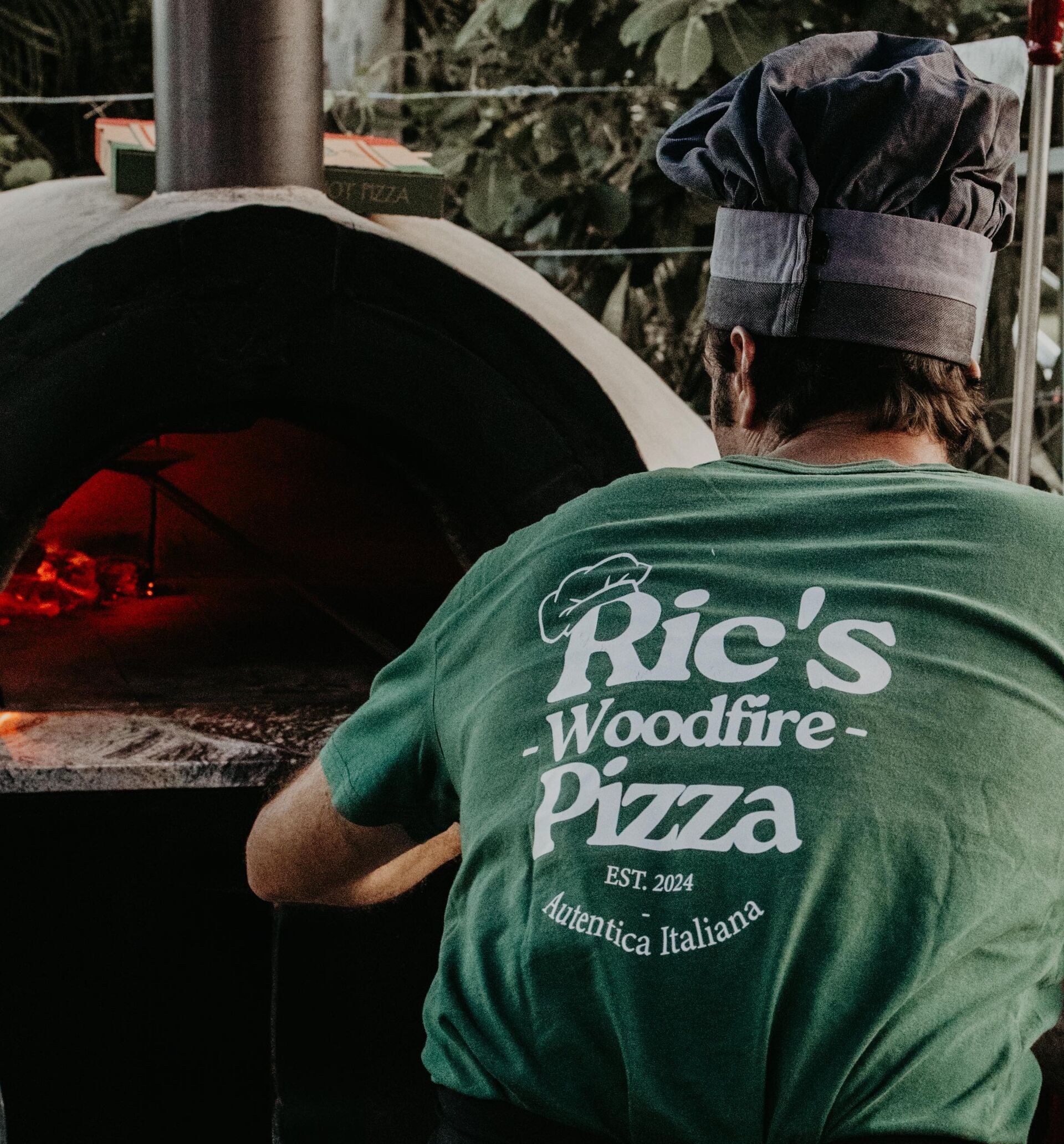 Authentic wood-fire pizza baking in a roaring oven at Ric's Woodfire Pizza Magnetic Island